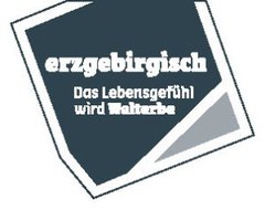 Logo mit dem Slogan: Erzgebirgisch - Das Lebensgefühl wird Welterbe.