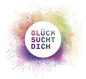 Logo: farbiger Kreis mit dem Schriftzug Glück sucht dich
